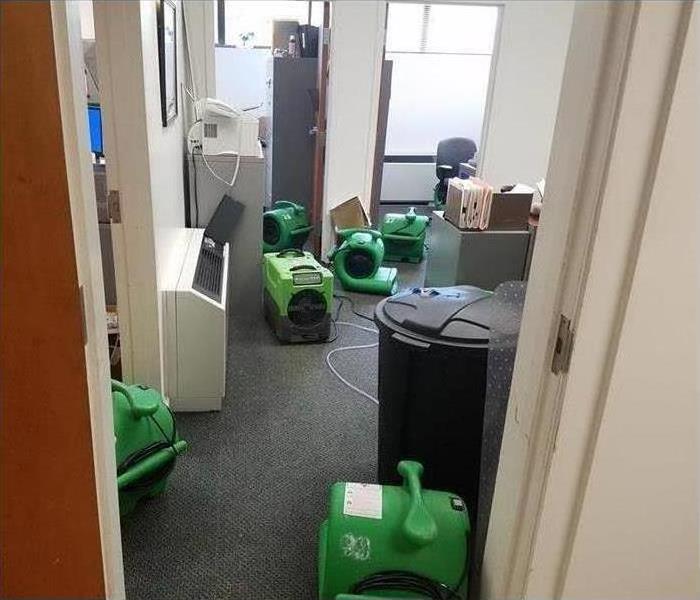 Office with drying machines placed on the floor